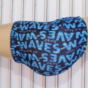 Dark blue WAVES boxer briefs with light blue printed branding, displayed on a mannequin against a white wooden background.