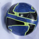 Nike REACT Soccer Ball featuring a blue and black panel design with neon green accents, ideal for training and competitive matches.