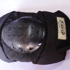 Heavy-duty knee pad with a hard plastic shell and adjustable straps, providing impact protection for sports and work safety.