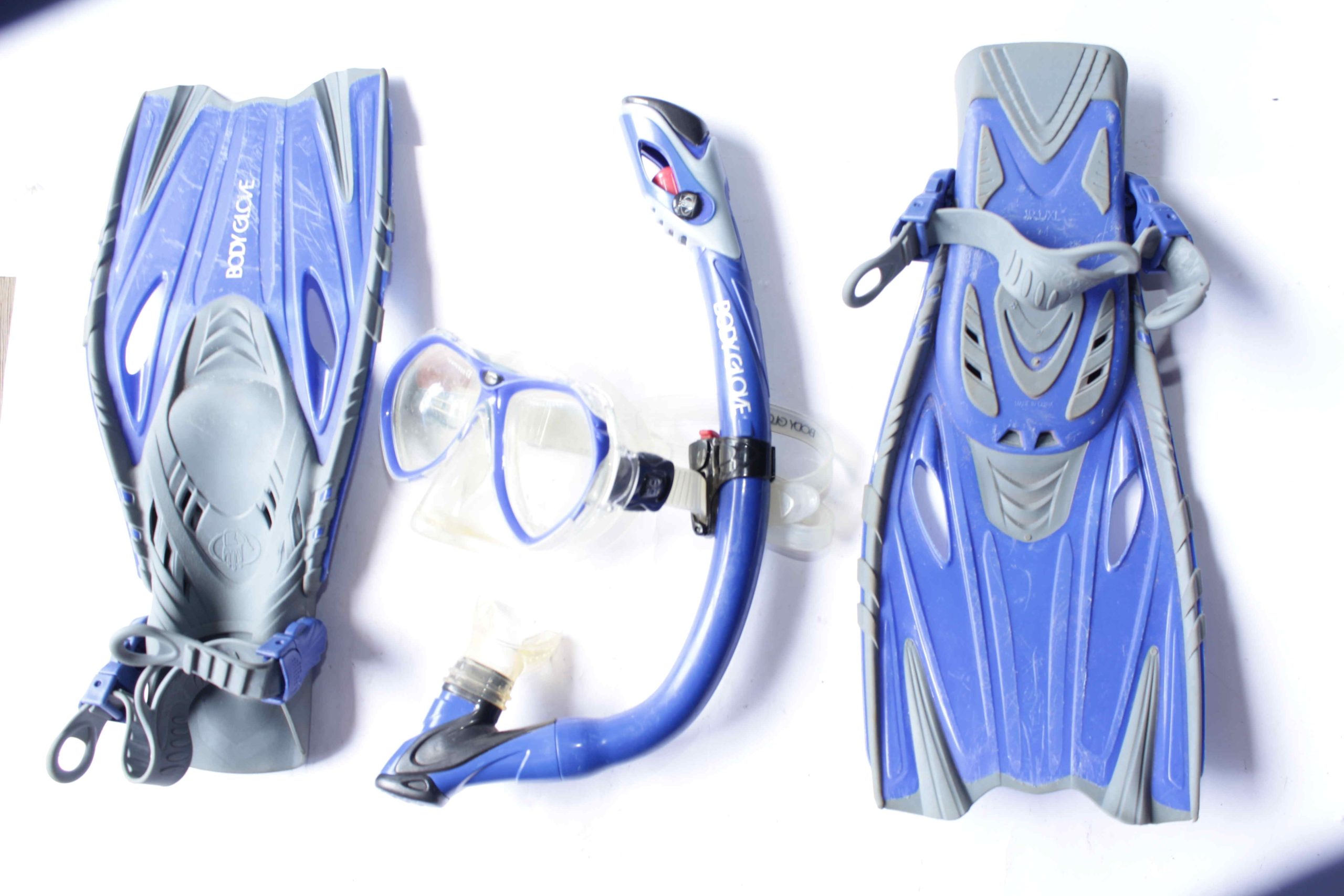 Body Glove Snorkeling Set featuring blue and gray fins, a blue diving mask, and a blue snorkel, displayed on a white background.